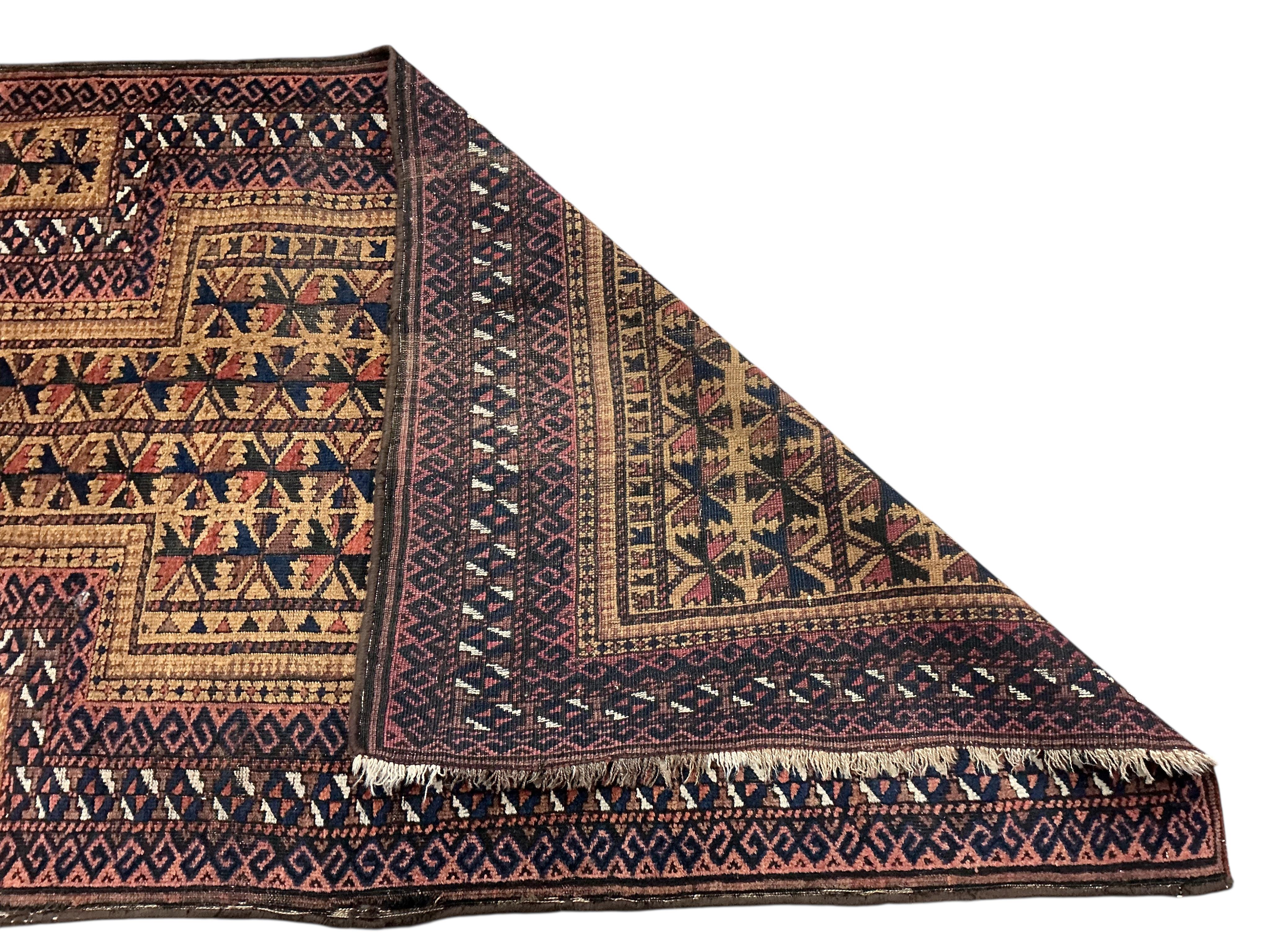 Two Belouch tribal rugs and an Afghan tribal rug, largest 200 x 110cm
